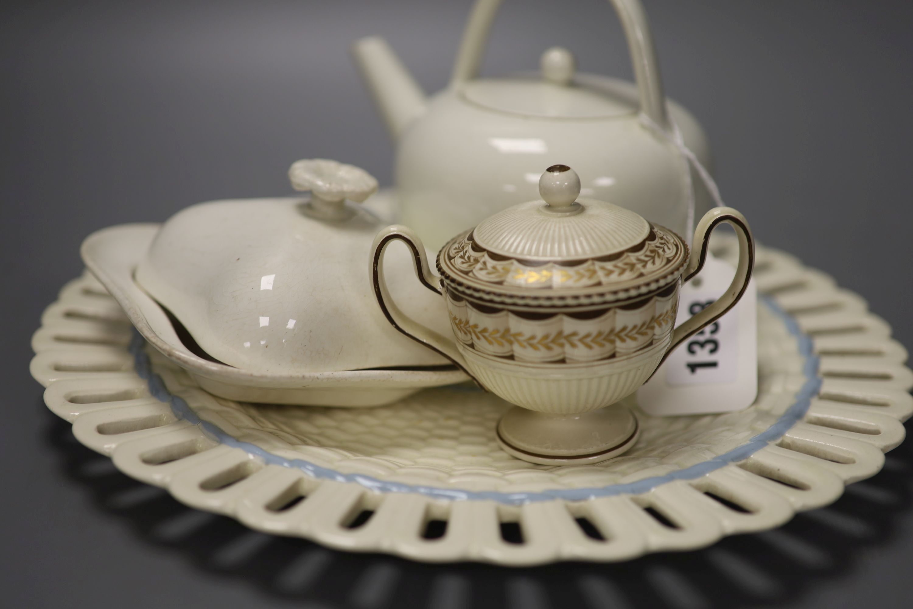 Four pieces of 19th century Wedgwood Queensware; a teapot, dish and cover and pot and cover together with a 20th century Queensware dis